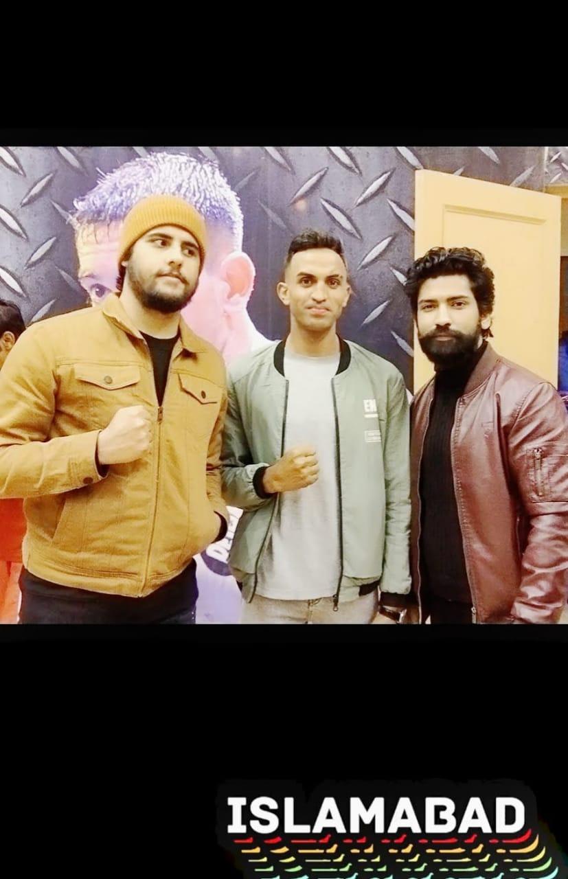 Coaches and fighters at a boxing event in Islamabad
